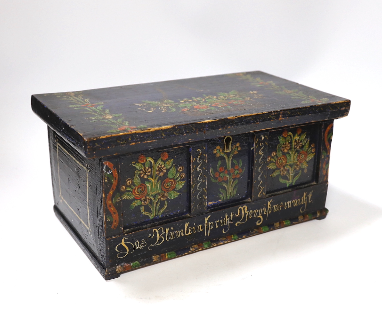 A 19th century German or Austrian floral painted pine casket, 32cm wide